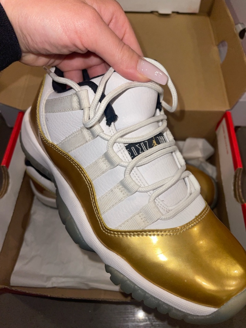 Air Jordan 11 Low Style White and Metallic Gold Sneaker